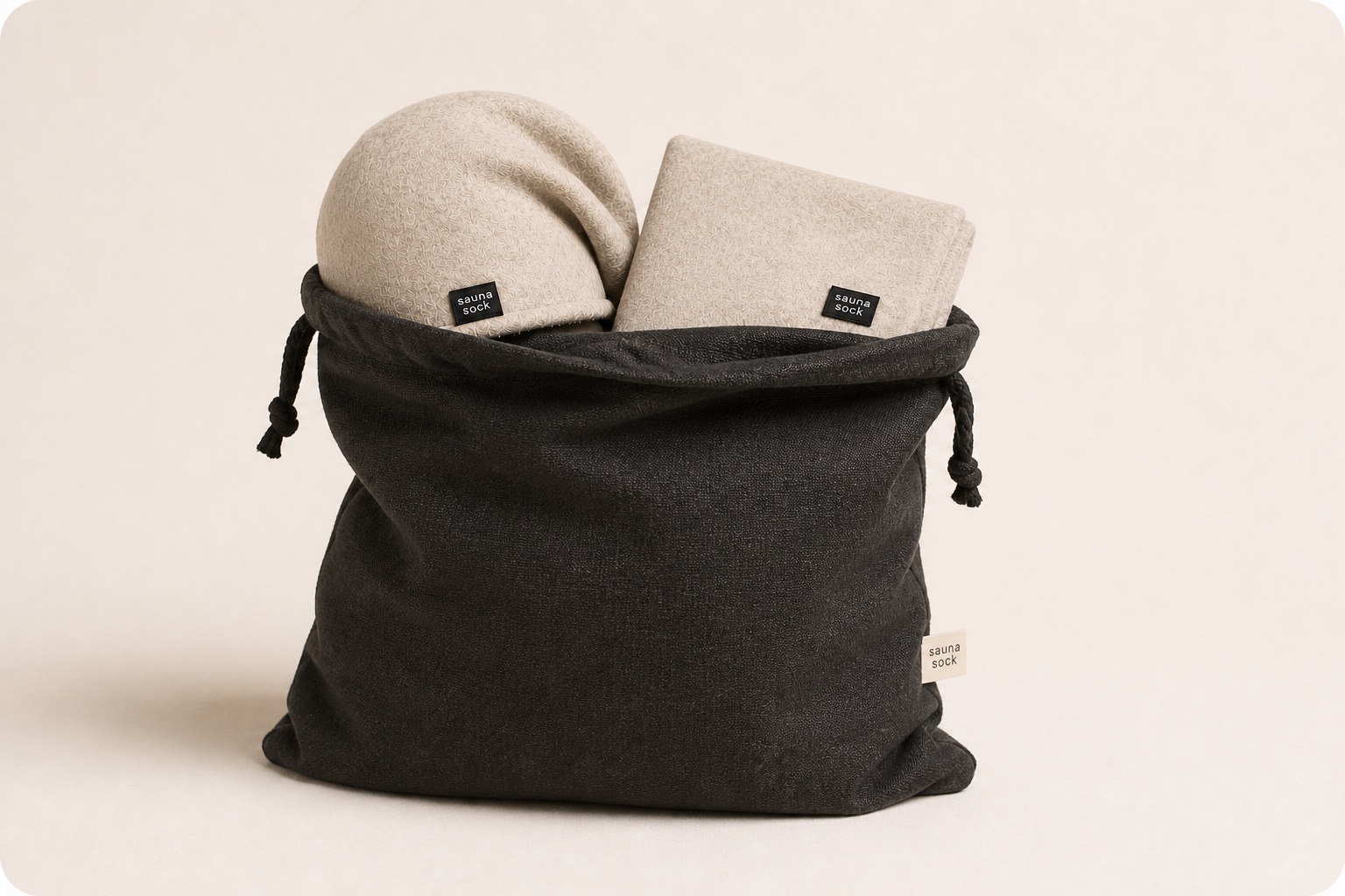 Charcoal Sauna Sack carrying a Sauna Sock and folded Sauna Seat